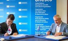 Korea Heritage Service Commissioner Choi Eung-chon (L) signs a framework arrangement with UNESCO in Paris on May 23, 2025, on the agency's contribution to the Intangible Cultural Heritage Fund under the Convention for the Safeguarding of the Intangible Cultural Heritage, in this photo provided by the agency. (PHOTO NOT FOR SALE) (Yonhap)
