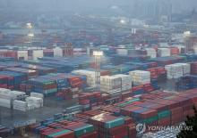 This photo, taken Feb. 1, 2025, shows stacks of shipping containers at a port in Busan, about 320 kilometers southeast of Seoul. (Yonhap)