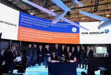 This file photo, provided by the Korea Defense Industry Association, shows officials from Hanwha Aerospace Co. and Poland's armament firm WB Group signing an agreement to create a joint venture aimed at manufacturing guided missiles for the Homar-K multiple launch rocket system in Poland on Sept. 2, 2025. (PHOTO NOT FOR SALE) (Yonhap)