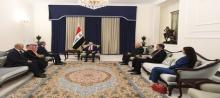 President, Abdul Latif Jamal Rashid (center), receives an Arab delegation in Baghdad