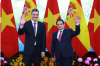 PM Pham Minh Chinh (R) and his Spanish counterpart Pedro Sánchez in Hanoi in April. (Photo: VNA)