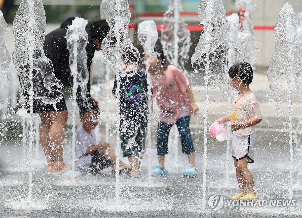 Playing in fountain on hot day