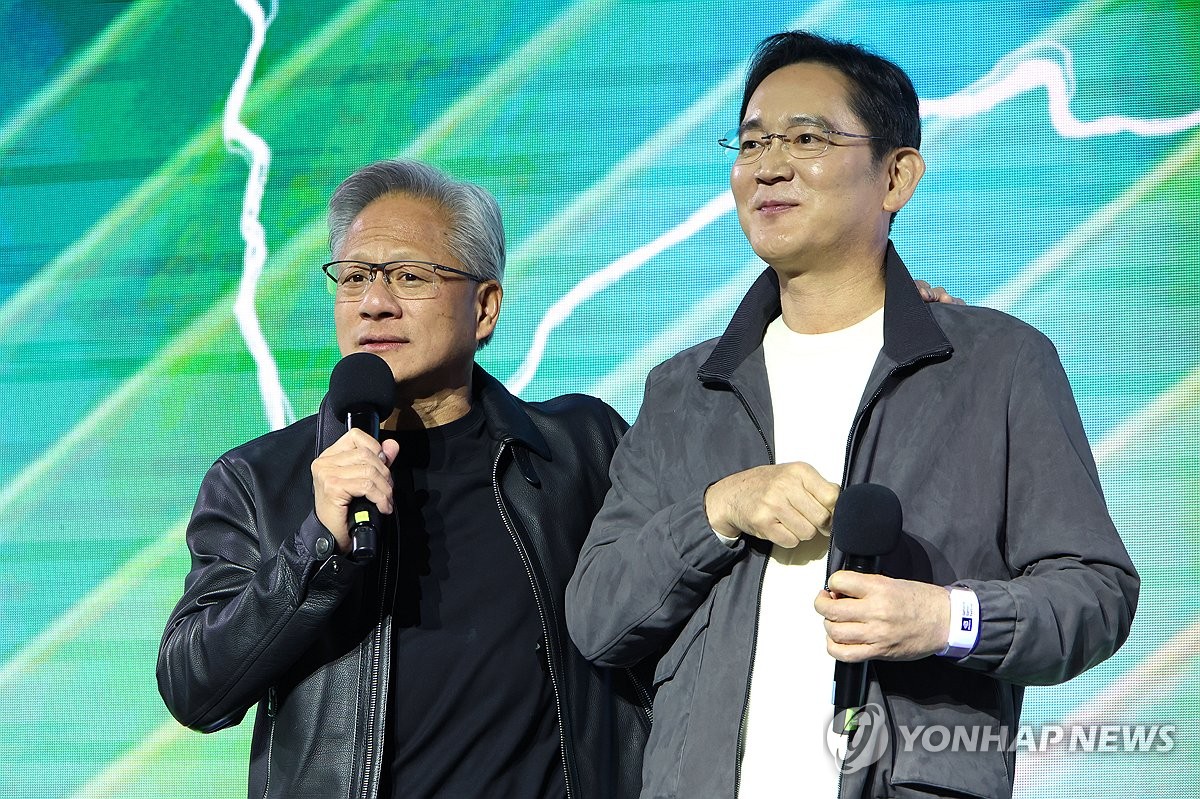 Nvidia Chief Executive Officer Jensen Huang (L) speaks during a ceremony marking the 25th anniversary of the launch of the GeForce graphics processing unit (GPU) in Seoul on Oct. 30, 2025, with Samsung Electronics Chairman Lee Jae-yong. (Pool photo) (Yonhap)