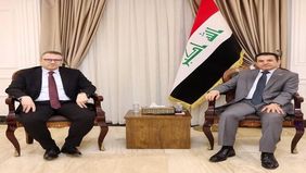 National Security Advisor Qasim al-Araji (right), the Turkish Ambassador to Baghdad, Anil Bora Anan (left)