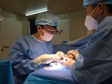 Vietnamese surgeons working on the injured finger. — Photo courtesy of FHL 2.6.