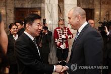 National Assembly Speaker Kim Jin-pyo (L) shakes hands with Bulgarian President Rumen Radev at the presidential palace in Bulgaria's capital of Sofia on Feb. 12, 2024 (local time), in this photo provided by Kim's office. (PHOTO NOT FOR SALE) (Yonhap)