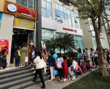 This file photo taken Jan. 22, 2024, and provided by Genesis BBQ, shows customers lined up for fried chicken carryout at the South Korean chicken franchise's delivery and pickup outlet in Hanoi, Vietnam, during a soft opening ahead of its grand opening on Feb. 16. (PHOTO NOT FOR SALE) (Yonhap)