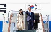 This file photo, taken June 15, 2024, shows President Yoon Suk Yeol (R) and first lady Kim Keon Hee before they board their flight back to South Korea at Samarkand International Airport in Uzbekistan. (Yonhap)