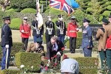 A tombstone dedication ceremony for the four British soldiers killed during the Korean War is under way at the U.N. Memorial Cemetery in the southeastern city of Busan on Nov. 12, 2024. (Yonhap)