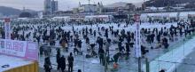 Visitors enjoy ice fishing at the 2025 Hwacheon Sancheoneo Ice Festival in Hwacheon, Gangwon Province, on Jan. 11, 2025. (Yonhap)