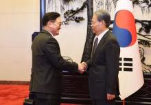 South Korean National Assembly Speaker Woo Won-shik (L) shakes hands with Zhao Leji, chairman of the Standing Committee of the National People's Congress in China, before their meeting in Beijing on Feb. 5, 2025, in this photo provided by the speaker's office. (PHOTO NOT FOR SALE) (Yonhap)