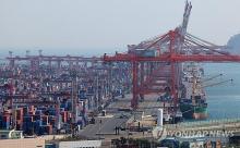 Shipping containers are stacked at a port in the southeastern city of Busan, in this file photo taken April 1, 2024. (Yonhap)