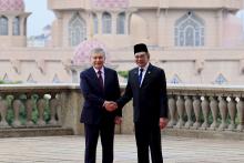 Uzbekistan’s President Shavkat Mirziyoyev with Malaysian PM, Datuk Seri Anwar Ibrahim.