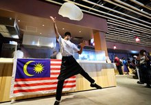 OSAKA, June 2 -– Roti canai maker Muhammad Muiz Ruzaini, 24, demonstrates the art of flipping “flying roti canai” at the Malaysia Pavilion Cafe during Expo 2025 Osaka, which runs from April 13 to October 13. --fotoBERNAMA (2025) COPYRIGHT RESERVED