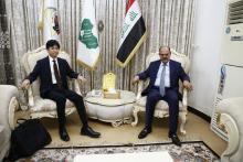 head of the IJS, head of the AJF, Mu'ayyad Al-Lami, (right), Japanese Chargé d'Affaires in Baghdad, Yokotakenji (left)