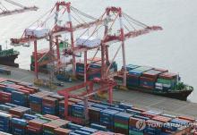 Shipping containers are stacked at a port in the southeastern city of Busan, in this file photo taken Jan. 1, 2024. (Yonhap)