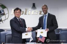 Cho Chang-rae (L), South Korea's deputy defense minister for policy, shakes hands with Vipin Narang, principal U.S. deputy assistant secretary of defense for space policy, after signing a framework document on the Nuclear Consultative Group at the Pentagon on Feb. 12, 2024, in this file photo provided by the defense ministry. (PHOTO NOT FOR SALE) (Yonhap)