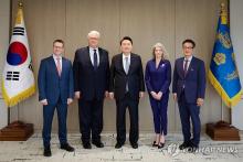 President Yoon Suk Yeol (C) meets with John Hamre (2nd from L), president of the Center for Strategic and International Studies; former U.S. Deputy National Security Adviser Matt Pottinger (L); Allison Hooker (2nd from R), former senior director for Asian affairs at the White House National Security Council; and Victor Cha, Korea Chair at the Center for Strategic and International Studies, at the presidential office in Seoul on March 6, 2024, in this photo provided by the office. (PHOTO NOT FOR SALE) (Yonha