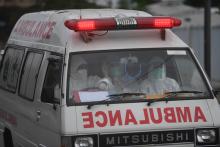 An ambulance enters Wisma Atlet Emergency Hospital in Kemayoran, Jakarta on January 2021. (ANTARA FOTO/Akbar Nugroho Gumay/foc/aa)