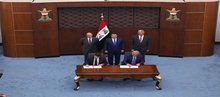 Iraqi PM, Mohammed Shia al-Sudani (center/standing), Iraqi Oil Minister Abdul Ghani Hayyan al-Sawad (right), US President's envoy Tom Barrack (left)