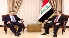 National Security Advisor Qasim Al-Araji (right), the Russian Ambassador to Baghdad, Elbrus Kotrashev, (left)