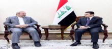 the National Security Adviser Qasim al-Araji (right), the Iranian Ambassador to Baghdad, Muhammad Kazim al-Sadiq (left)
