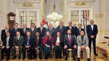 Iraqi FM, Fuad Hussein stands among the Arab ambassadors in Vienna