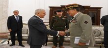 President Abdul Latif Jamal Rashid (left), the Commander of the North Atlantic Treaty Organization (NATO) Mission in Iraq Christoph Hentzi (right)