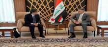 Basra Governor Asaad Al-Eidani (right), the Japanese Ambassador to Iraq, Akira Endo (left)