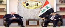 National Security Advisor Qasim al-Araji (right), the Ambassador of the Arab Republic of Egypt to Iraq, Ahmed Samir (left)