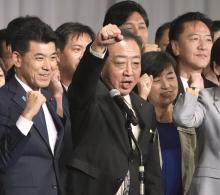 Former Prime Minister Yoshihiko Noda (front R) is seen in high spirits following his election as the new leader of the Constitutional Democratic Party of Japan in Tokyo on Sept. 23, 2024. (Kyodo)