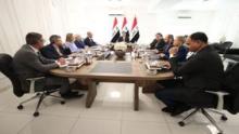 Acting Speaker of the Council of Representatives Mohsen Al-Mandalawi (center) with a group of Europe Ambassadors 