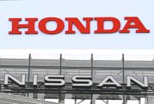 Combined photo shows the corporate logos of Honda Motor Co. (top) and Nissan Motor Co. (Kyodo)