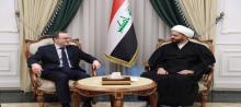 Secretary-General of the Asa'ib Ahl al-Haq Movement, Sheikh Qais al-Khazali (right) Russian Ambassador to Iraq, Albrus Kotrashev, (left)