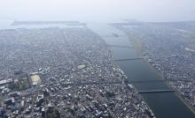 Photo taken on Aug. 9, 2024, from a Kyodo News helicopter shows the southwestern Japan city of Miyazaki facing the Hyuga Nada Sea. (Kyodo)