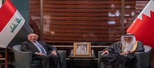 Bahrini FM, Abdullatif bin Rashid Al-Zayani (right), Iraqi FM, Fuad Hussein (left) 