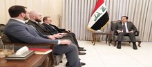 First Deputy Speaker of Parliament Mohsen Al-Mandalawi (right), the Ambassador of the Russian Federation to Iraq, Elbrus Kotrashev, (first left) and his accompanying delegation.