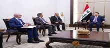 PM, Mohammed Shia Al-Sudani (right), Gregory Bloom, Vice President of the American oil services company Baker Hughes (left)