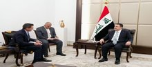 PM, Mohammed Shia Al-Sudani (right), the President of the US oil and energy technology company Halliburton, Shannon Slocum (left)