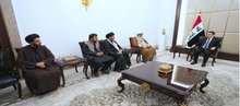 PM, Mohammed Shia Al-Sudani (right), the Secretary-General of the Muslim Unity Party and member of the Pakistani Senate, Sheikh Raja Nasir Abbas Jafri, (left)