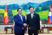 Prime Minister Pham Minh Chinh meets with General Secretary of the Lao People’s Revolutionary Party (LPRP) and President of Laos Thongloun Sisoulith (Photo: VNA)