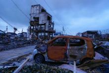 The site of a gutted market in Wajima in Ishikawa Prefecture, central Japan, is pictured on Feb. 1, 2024, a month after a blaze broke out following a strong earthquake. (Kyodo)