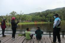 Some people enjoy Tambing Lake at Lore Lindu National Park, Poso District, C Sulawesi Province.  (ANTARA/Kristina Natalia)