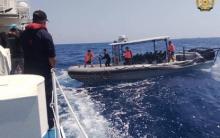 RESUPPLY MISSION. Philippine Navy soldiers transfer essential cargoes from Unaizah May 4 and BRP Cabra to the BRP Sierra Madre off Ayungin Shoal on Saturday (March 23, 2024). The resupply boat Unaizah May 4 was damaged by yet another water cannon attack by the Chinese Coast Guard. (Photo courtesy of the Armed Forces of the Philippines)