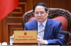 Prime Minister Pham Minh Chinh chairs a meeting on June 28 to continue reviewing and resolving US concerns regarding trade and tariffs. (Photo: VNA)