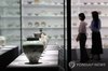 Visitors view Joseon-era ceramics on display during a special exhibition at the National Museum of Korea in Seoul on June 9, 2025. (Yonhap)