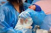 This file photo taken July 24, 2025, shows a nurse holding a baby at a hospital in the city of Goyang, Gyeonggi Province. (Yonhap)