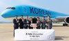 Officials from Hyundai Motor Co. and Korean Airlines Co. pose for a photo during a delivery ceremony of Hyundai's X-ble Shoulder held at Korean Air's aircraft maintenance center in Incheon, west of Seoul, on July 8, 2025. (PHOTO NOT FOR SALE) (Yonhap)