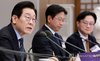 President Lee Jae Myung (L) speaks during a meeting to discuss plans to foster the semiconductor industry held at the presidential office in Seoul on Dec. 10, 2025. (Pool photo) (Yonhap)