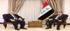 Iraqi National Security Advisor Qasim al-Araji (right), the Hungarian Ambassador to Iraq, Osama al-Nafaa, (left)